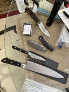 A batch of knives that need sharpening