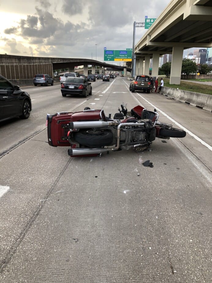 My Motorcycle Laying on the Freeway after a distracted driver hit me